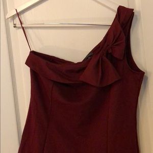 One shoulder burgundy top with statement bow